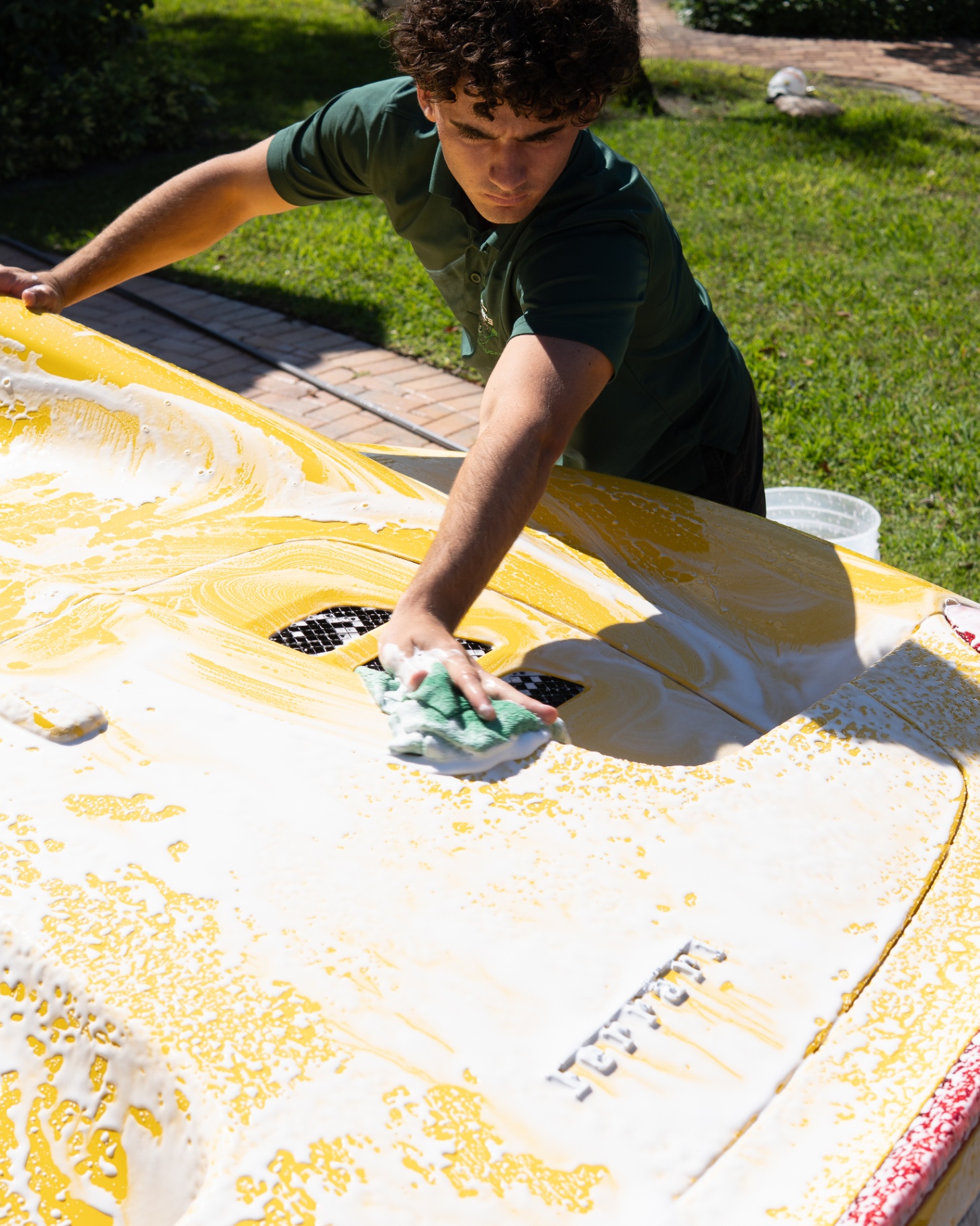 Hand-washing a Ferrari with premium foam soap